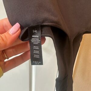 Skims Essential One Shoulder Bodysuit in Black